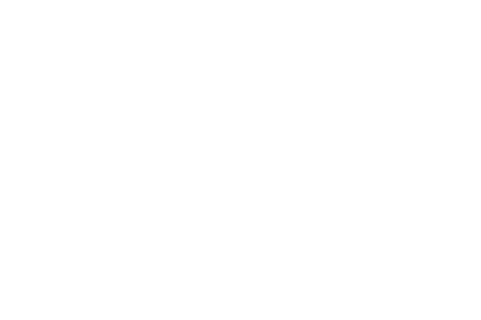 Three lit windows in a row in a long dark wall at night.